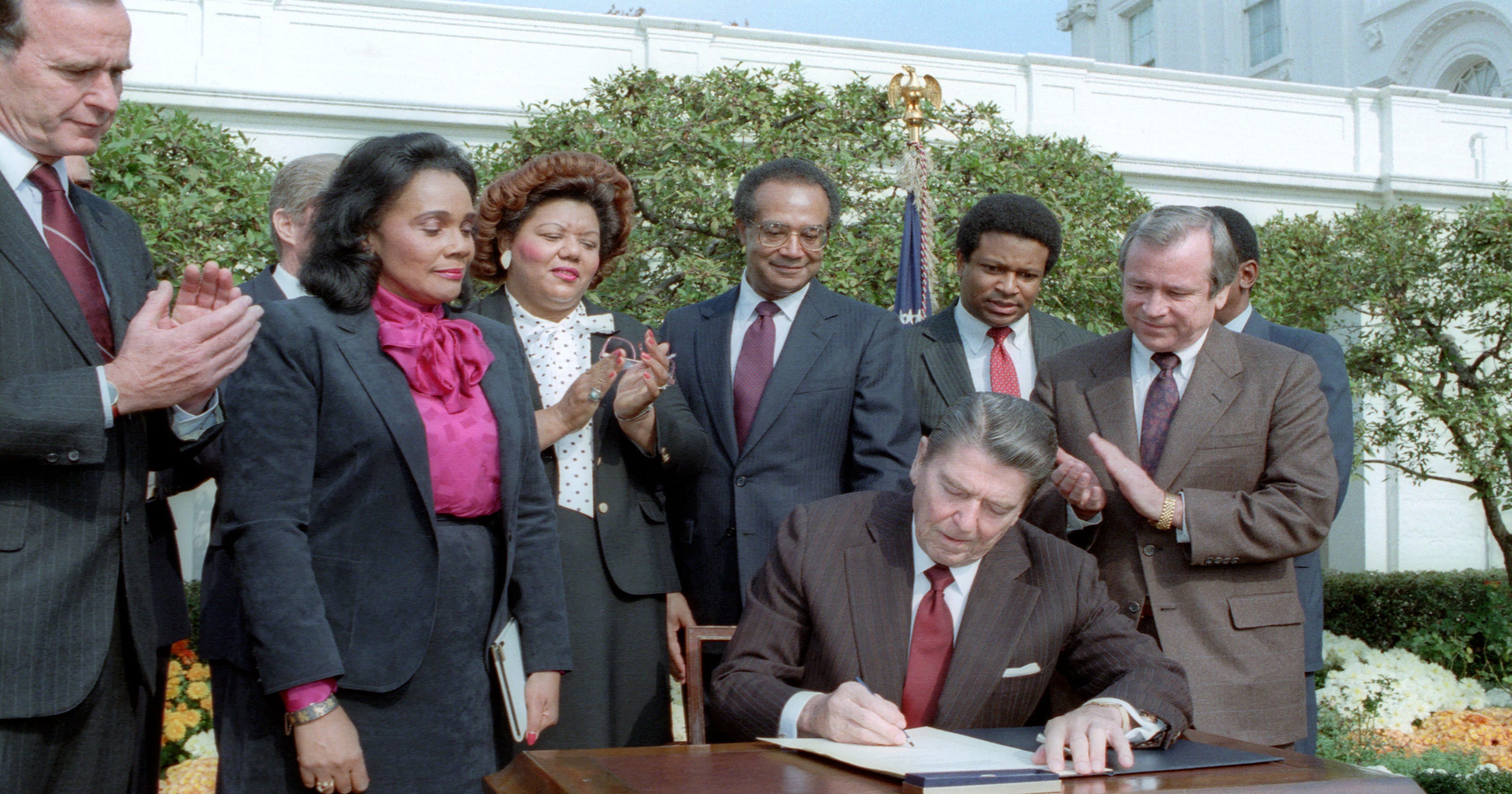 Image result for Ronald Reagan signed a bill establishing a federal holiday on the third Monday of January in honor of civil rights leader Dr. Martin Luther King Jr.