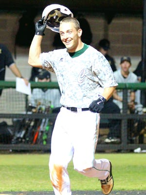 Catholic High's Carl Gindl reacts after scoring in Catholic's 10-1 win over Milton High Tuesday.