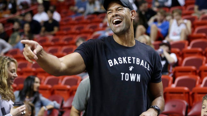FILE - In this Dec. 20, 2015, file photo, former Miami heat player Shane Battier gestures to his former teammates before an NBA basketball between the Miami Heat and Portland Trail Blazers in Miami. Battier was hired Thursday, Feb. 16, 2017, to lead the new analytics department for the Miami Heat, the team he helped win NBA championships in 2012 and 2013. (AP Photo/Lynne Sladky, File)