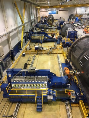 Portions of Boeing Dreamliner fuselages are worked