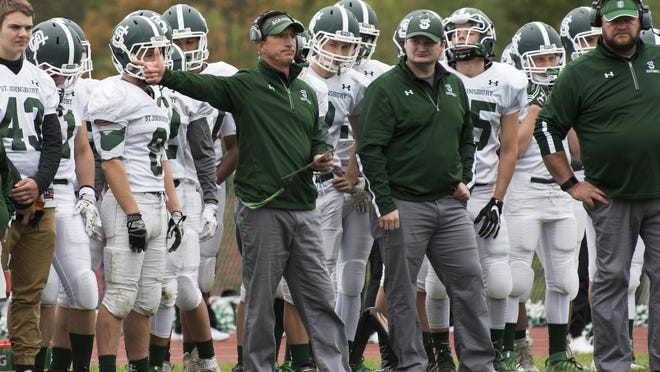 St. Johnsbury head coach Rich Alercio directs during the high school football game between the St. Johnsbury Hilltoppers and the Champlain Valley Union Redhawks last year.