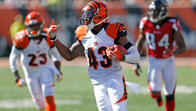 Cincinnati Bengals strong safety George Iloka (43) returns the second of his two interceptions against the Atlanta Falcons during the fourth quarter of their game played at Paul Brown Stadium in Cincinnati, Ohio Sunday September 14, 2014. The Enquirer/Gary Landers