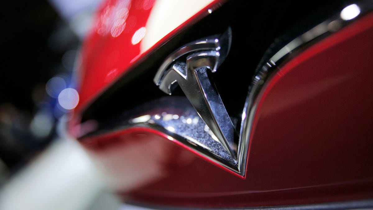 The logo of the Tesla Model S on display at the Paris Auto Show in Paris.