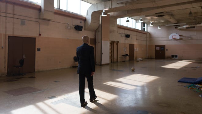 Detroit School District Superintendent Nikolai Vitti walks through an unused gym on Wednesday, May 9, 2018 at Henry Ford High School in Detroit.
