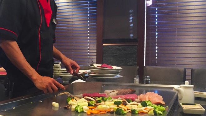 Habachi chef Dong puts on a show for hungry customers at Sakura.