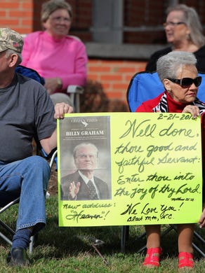 A large crowd gathered in downtown Black Mountain to say goodbye to the Rev. Billy Graham, who passed away at his Montreat home on Feb. 21. Graham's funeral procession, which took him to Charlotte, exited I-40 and made its way east on U.S. 70 through the center of town, just miles from his former home.