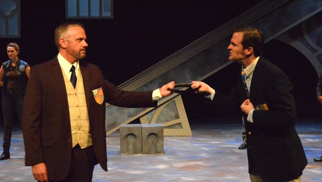 Robert McLean as Henry Bolingbroke, left, and Robert Kauzlaric as King Richard II in the Michigan Shakespeare Festival's production of "Richard II."