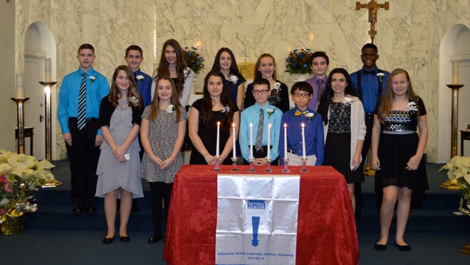 (Front row, from left) Joy Asselta, Caroline Bernhardt, Anastazja Astacio, Christopher Fanelli, Christopher Bernard, Carly Fanucci, Emma Fehrenbach; and back row, from left) Anthony Kristovich, Dominick Forgen, Mattie Hiles, Corinne Vicente, Abigail Moore, Samson Gerner, and Nickvens Delva, were inducted into the National Junior Honor Society on Feb. 3 at Bishop Schad Regional School in Vineland.