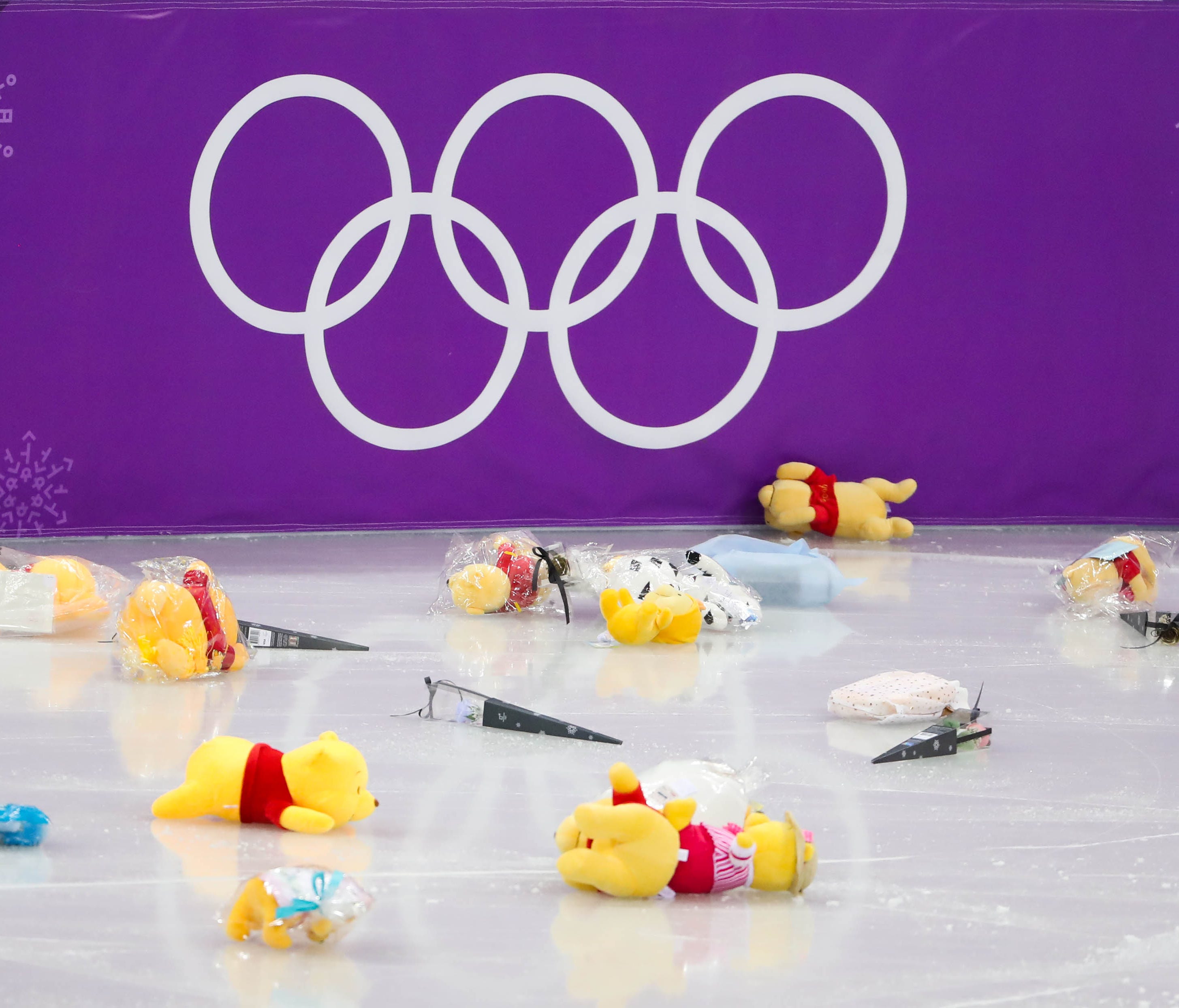 Stuffed bears on the Olympic ice.