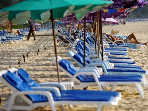File picture: This picture taken on Dec. 11, 2008, shows foreign tourists rest on Karon Beach, on the western coast of Phuket Island, southern Thailand.