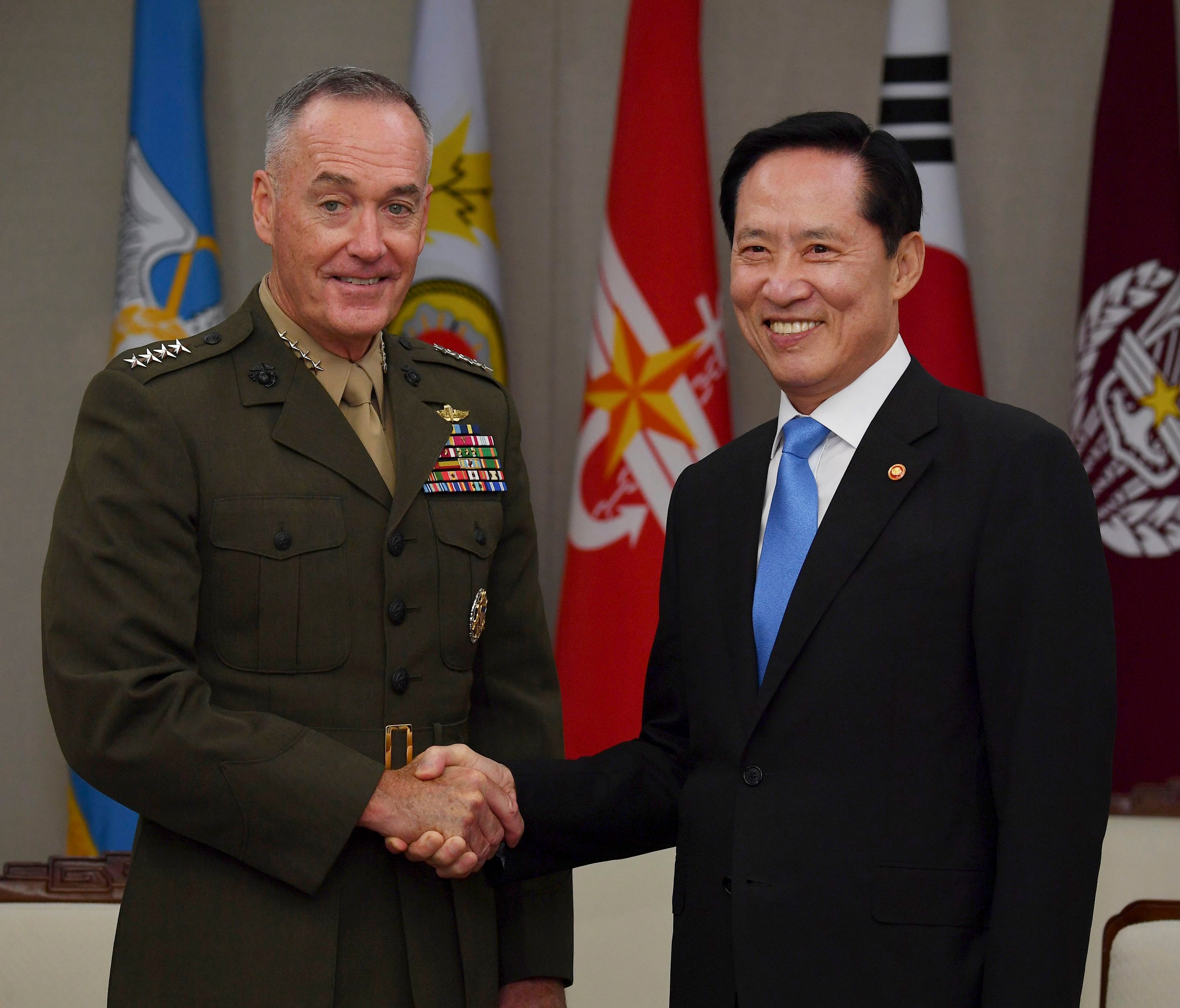 Marine Corps General Joseph Dunford, chairman of the Joint Chiefs of Staff, shakes hands with South Korean Defense Minister Song Young-Moo.