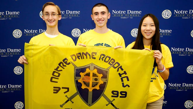 Notre Dame High School robotics team members Adrian Haluska, left, Matt Connolly and Jacqueline Chen traveled to St. Louis to battle in the FIRST Robotics world competition at the end of April. The local team, Electric Fire #3799, took 40th place out of 66 teams.