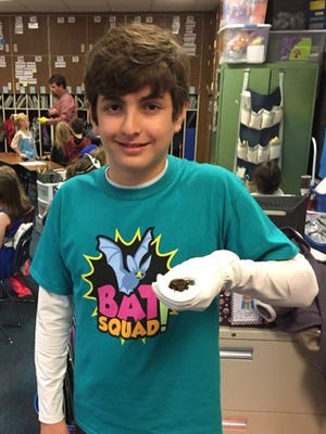 Local resident Logan Carter, 12, is part of the Bat Squad, which is sponsoring Bat Week and other events.