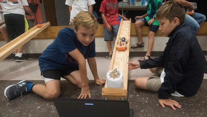 Clockwise from front left, Braeden Murawski, William Koger, Eric Campbell, Frankie Smith and Owen Emery run a series of crash tests on Wednesday, June 21, 2017, while learning to build a crash barrier system at a Science, Technology, Engineering, Arts and Math Camp at Woodlawn Beach Middle School in Gulf Breeze.