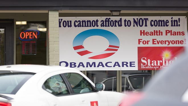 A sign advertising health insurance under the Affordable Care Act in east Austin in 2015.
