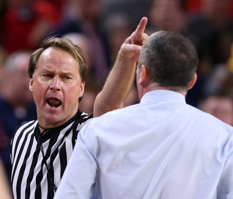 Official John Higgins (left) ejects head coach Bobby Hurley of the Arizona State Sun Devils (right) during the second half of the college basketball game at Wells Fargo Arena on January 3, 2016 in Tempe, Arizona.