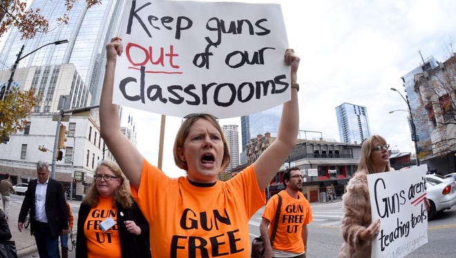 Stephanie Odam of Austin marches in a campus carry protest in Austin, Jan 8, 2015.