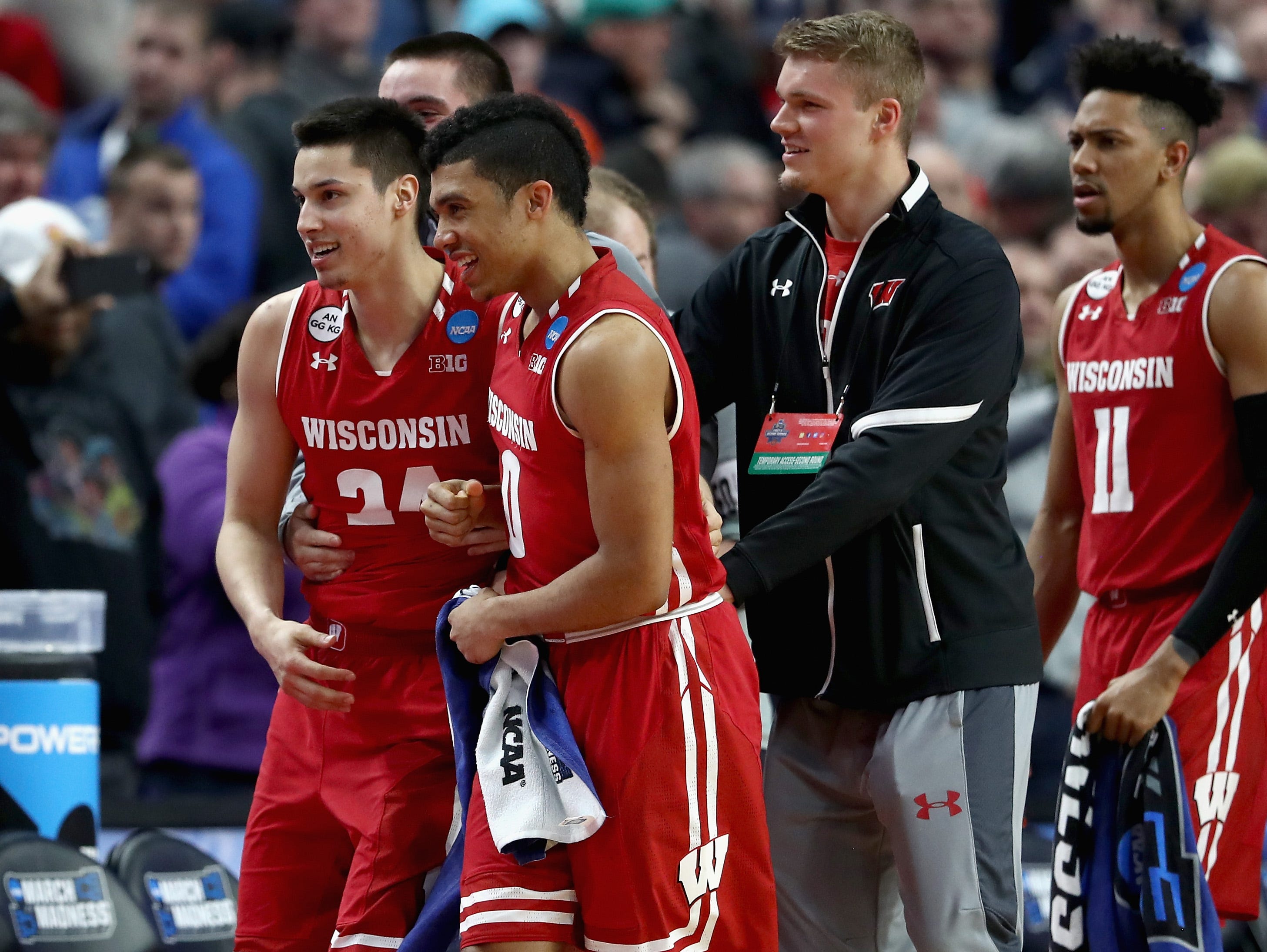 Bronson Koenig #24 and D'Mitrik Trice.