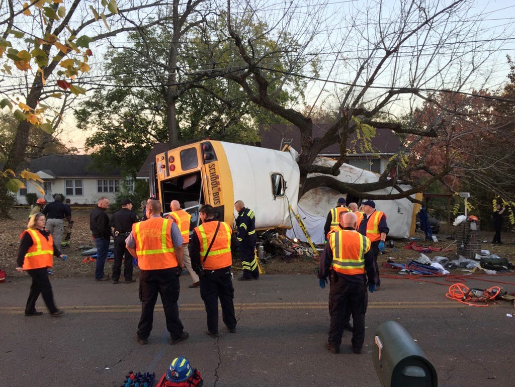 Chattanooga Fire Department personnel work the scene of a fatal elementary school bus crash in Chattanooga, Tenn.