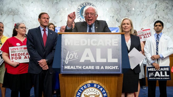 Sen. Bernie Sanders, joined by Sens. Richard Blumenthal and Kirsten Gillibrand and supporters, speaks at a news conference on Capitol Hill on Sept. 13, 2017, to unveil "Medicare for All" legislation.