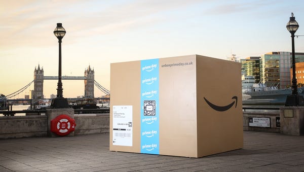 A 25-foot Amazon box sits near the Thames river...