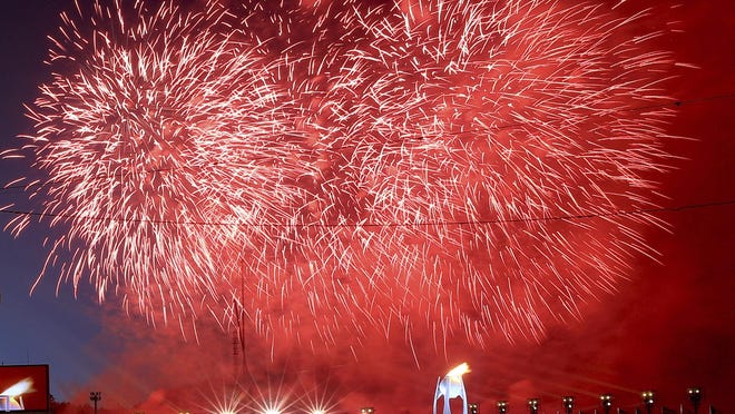 FILE - In this Friday, Feb. 9, 2018 file photo, fireworks explode after the Olympic flame was lit during the opening ceremony of the 2018 Winter Olympics in Pyeongchang, South Korea. On Friday, Feb. 9, 2018, The Associated Press has found that stories circulating on the internet that the death toll is rising rapidly from an outbreak of norovirus at the games are untrue. Norovirus is a common, infections bug that causes unpleasant symptoms but usually doesnât require medical attention. (Sean Haffey/Pool Photo via AP)