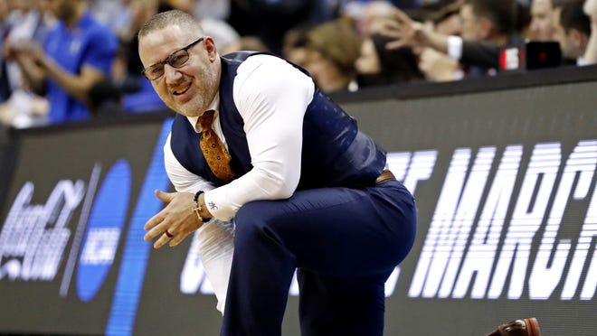 Virginia Tech head coach Buzz Williams kneels on the sideline during the second half against the Duke during the 2019 NCAA Tournament on March 29.