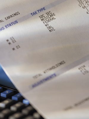 Pay check stub showing taxes withheld