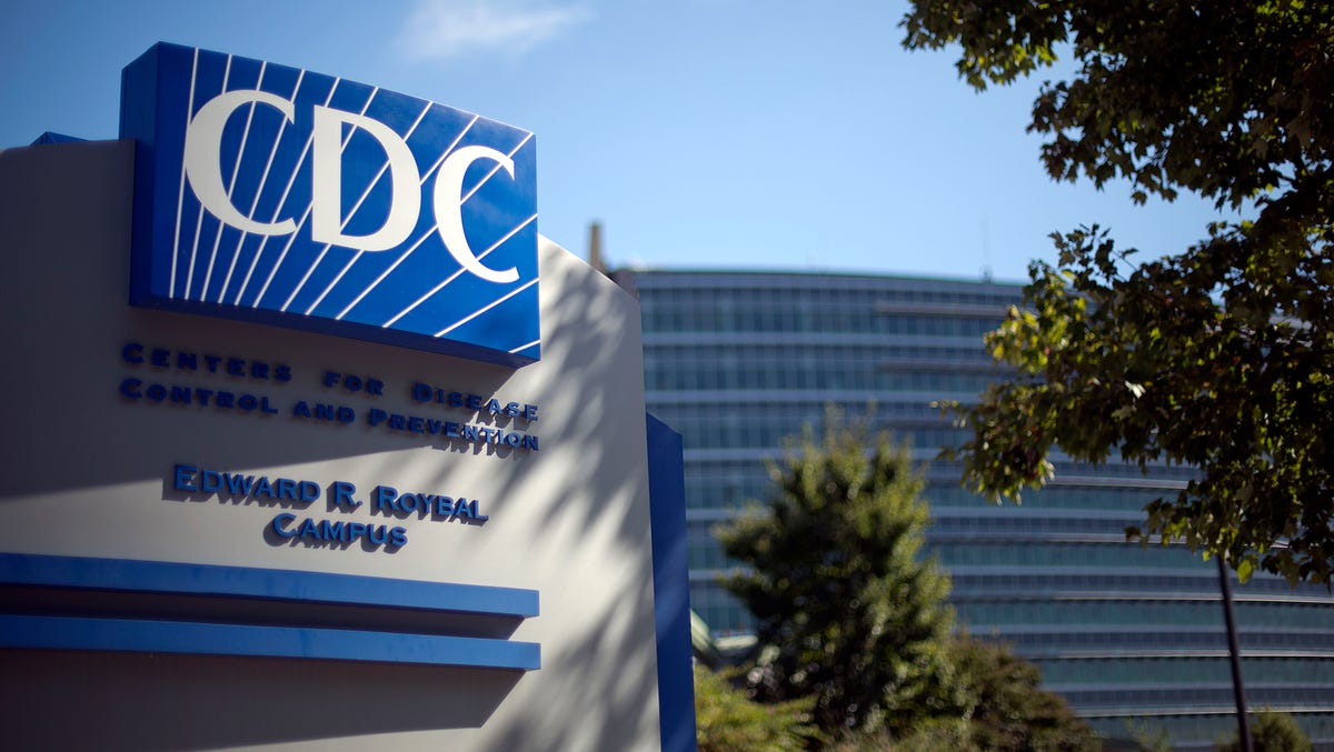 A sign marks the entrance to the federal Centers for Disease Control and Prevention,in Atlanta. The CDC closed two research labs Friday citing safety concerns following an anthrax scare.