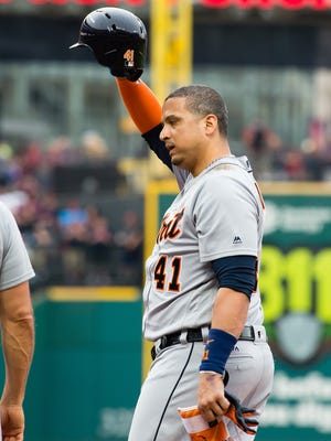 Tigers DH Victor Martinez waves to the fans after singling to left for his 2,000 career hit during the second inning Friday in Cleveland.
