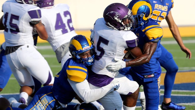 The Angelo State Rams defense stops McKendree University's Derrick Curry (5) from  gaining ground during the season opener at LeGrand Stadium at 1st Community Credit Union Field. ASU will host Texas A&M-Kingsville at 6 p.m. Saturday, Sept. 30.
