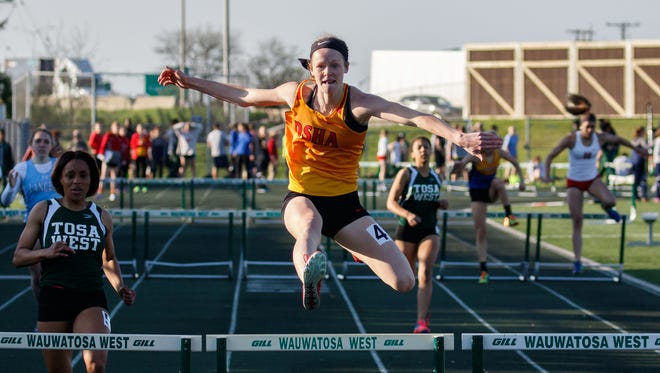 Divine Savior Holy Angels sophomore Jadin O'Brien competes in the 300-meter hurdles during the Greater Metro Conference track and field championships on May 15. O'Brien won the event in 44.48 seconds.