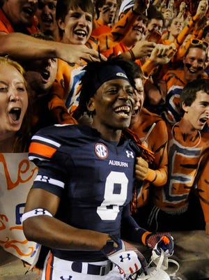Auburn Tigers wide receiver Tony Stevens (8) celebrates with fans after the game against the Mississippi Rebels at Jordan Hare Stadium.