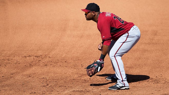 Arizona Diamondbacks first baseman Yasmany Tomas fields against the Colorado Rockies during spring training action at Salt River Fields at Talking Stick on March 29, 2015.