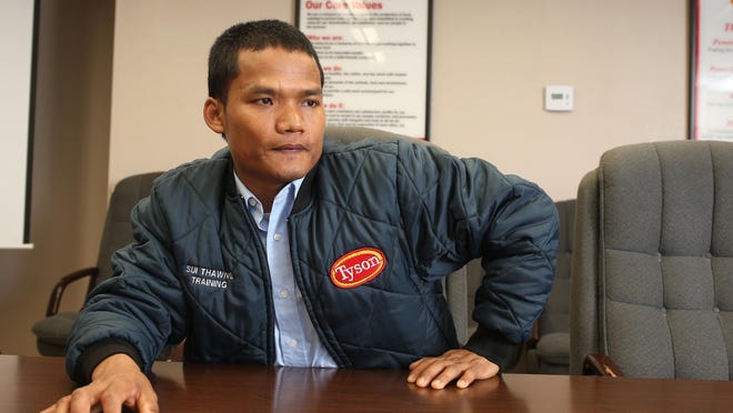Sui Thawng, a refugee from Burma, found a good job as a supervisor at Tyson Foods in Waterloo. The meatpacking plant has been an employment landing place for many of Waterloo's 1,200 to 1,500 Burmese refugees, including Thawng's wife.