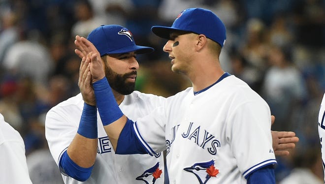 “Now, it’s up to us," All-Star outfielder Jose Bautista says after a front-office binge netted Troy Tulowitzki, right, and David Price.
