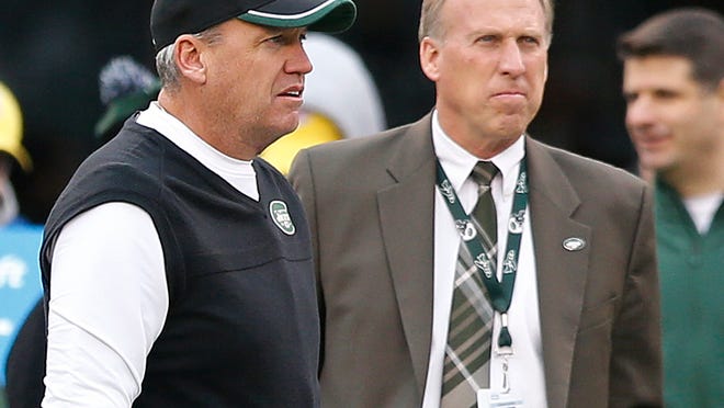 In this Dec. 21 photo, then-Jets head coach Rex Ryan and then-general manager John Idzik watch their team warm up. Both were fired Monday.
