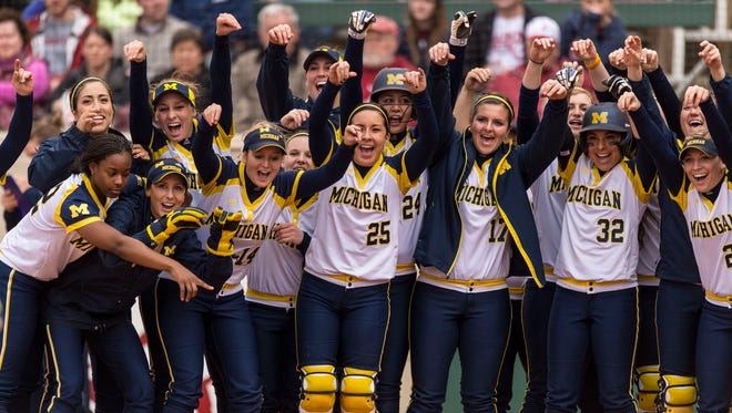 Michigan players cheers for outfielder Kelly Christner (21) as she rounds the bases on a home run during a college softball game, Saturday, Feb. 21, 2015, at Rhoads Stadium in Tuscaloosa, Ala.