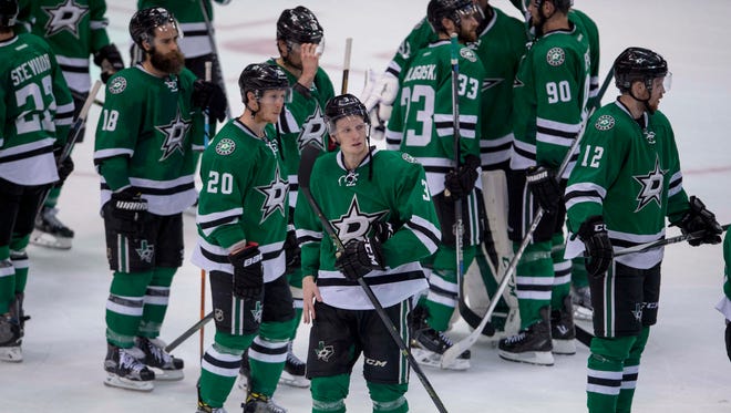 The Dallas Stars watch the St. Louis Blues players celebrate after winning game seven of the second round of the 2016 Stanley Cup Playoffs at American Airlines Center.