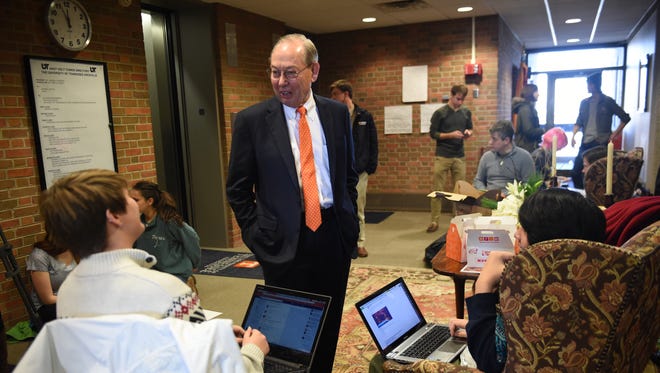 Chancellor Jimmy Cheek talks with students during a study-in outside of Cheek's office on Dec. 8, 2015, at the University of Tennessee.