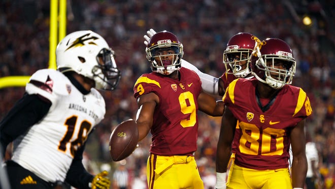 Oct 1, 2016: Southern California Trojans wide receiver JuJu Smith-Schuster (9) celebrates his touchdown with wide receiver Deontay Burnett (80) and wide receiver Darreus Rogers (back) during the first half against the Arizona State Sun Devils at Los Angeles Memorial Coliseum.