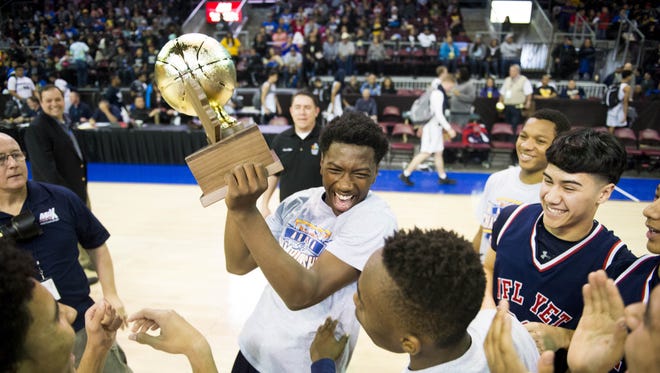 NFL YET's basketball team celebrates on the court after winning the 1A boys state championship game at the Prescott Valley Event Center in Prescott Valley on Saturday, Feb. 25, 2017.