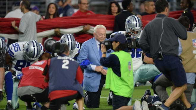 Sep 25, 2017; Glendale, AZ, USA; Dallas Cowboys owner Jerry Jones kneels with players prior to the national anthem prior to the game against the Arizona Cardinals at University of Phoenix Stadium. Mandatory Credit: Joe Camporeale-USA TODAY Sports
