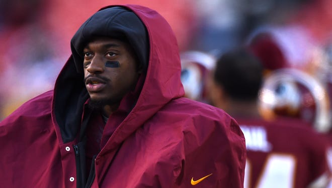Quarterback Robert Griffin III #10 of the Washington Redskins looks on against the St. Louis Rams at FedExField on December 7, 2014 in Landover, Maryland. The St. Louis Rams won, 24-0.