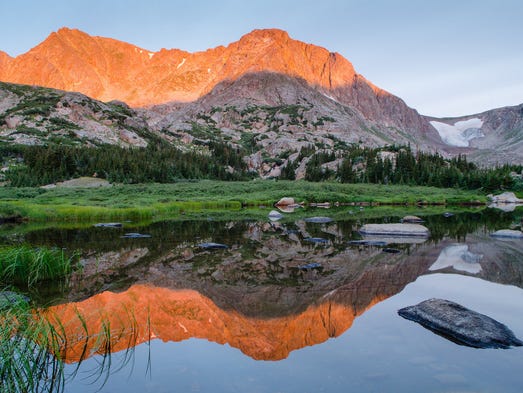Reflecting lakes with towering peaks behind can make