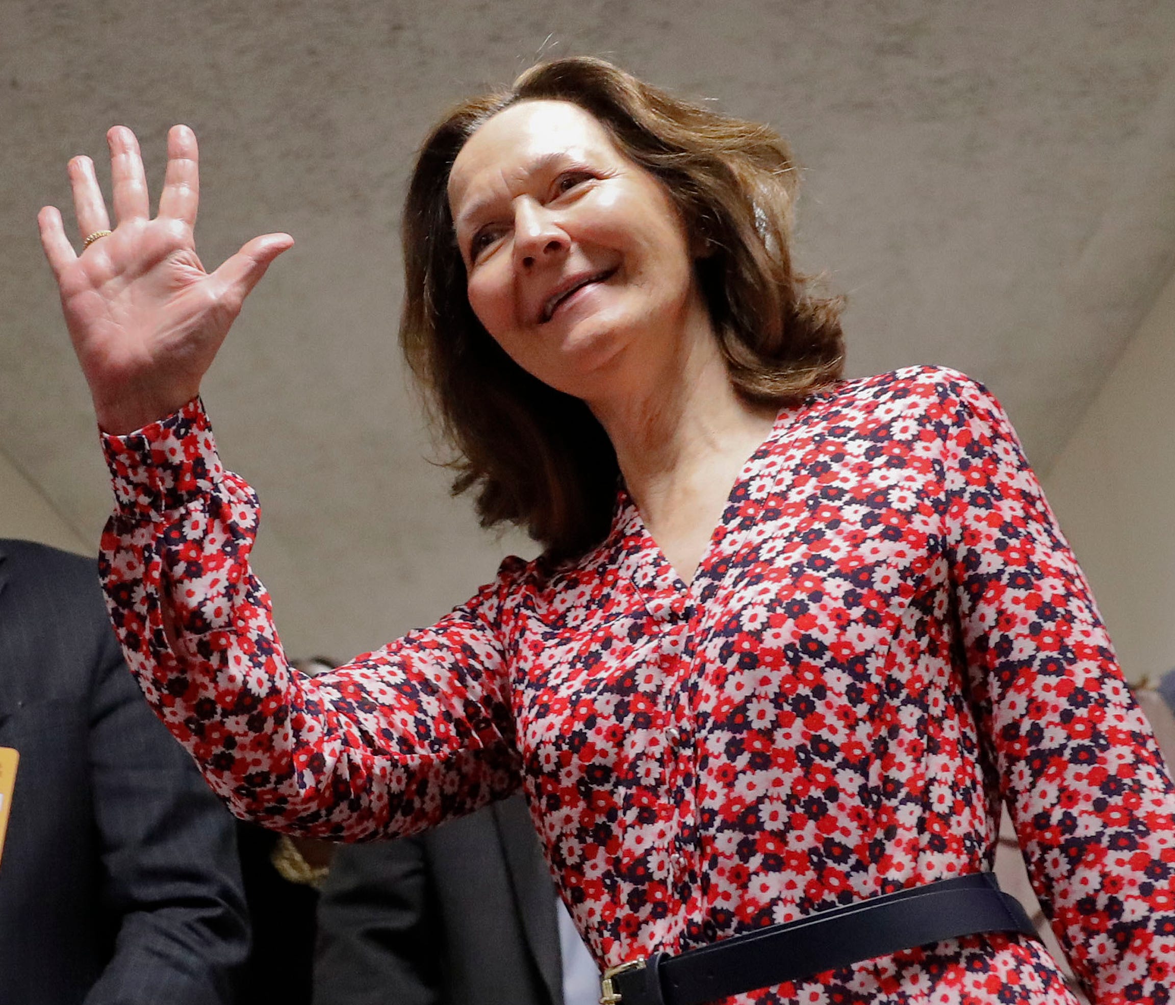 Gina Haspel waves as she arrives for her meeting with Sen. Joe Manchin, D-W.Va., on Capitol Hill.