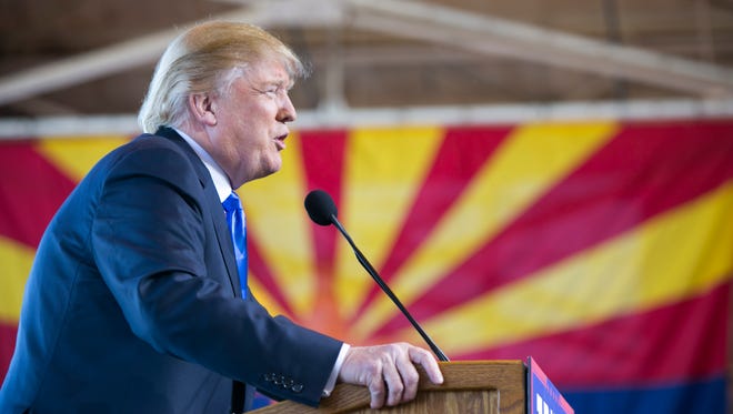 Republican Presidential candidate Donald Trump speaks during a campaign stop at Phoenix-Mesa Gateway Airport in Mea on December 16, 2015.