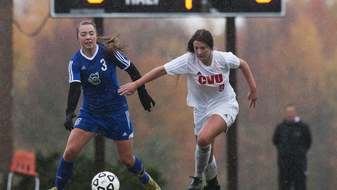 CVU's Catherine Cazayoux (9) battles for the ball with Colchester's Clara Johnson (3) during a high school girls soccer game against Saturday.