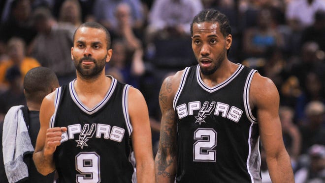 San Antonio Spurs guard Tony Parker and forward Kawhi Leonard during the first half against the Memphis Grizzlies.
