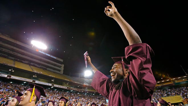 Gregory Pruitt Jr. celebrates after the ASU Spring Commencement and Convocation Program at Sun Devil Stadium on May 11.